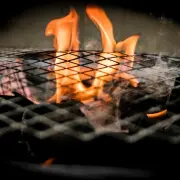 winter grilling keystone propane flames coming up inside a grill winter grilling
