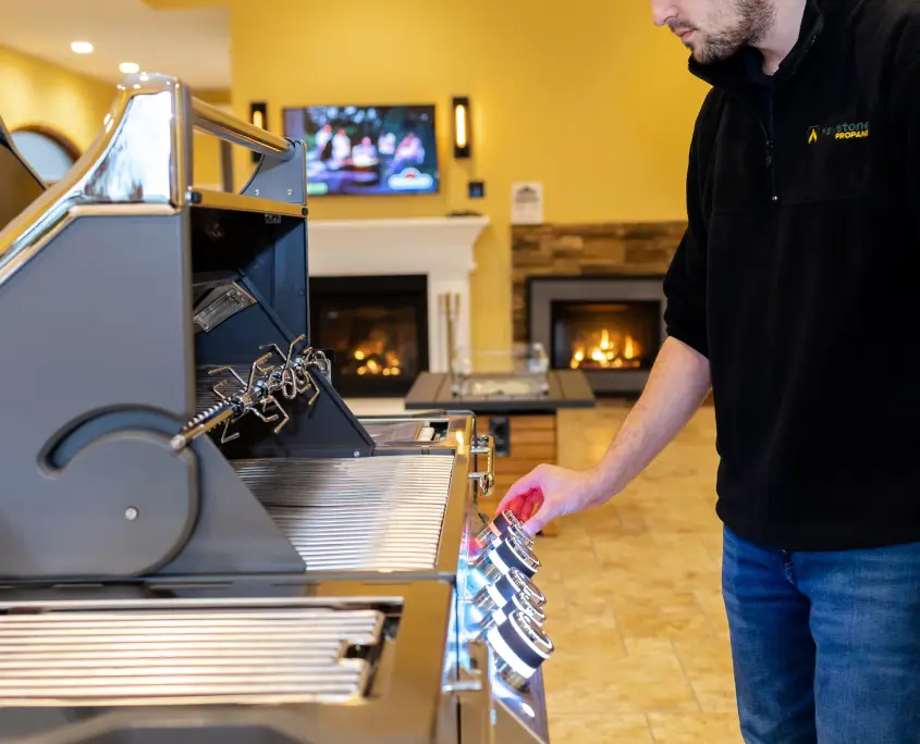 Employee demonstrating Napoleon grill