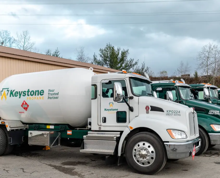 Delivery trucks in Throop yard