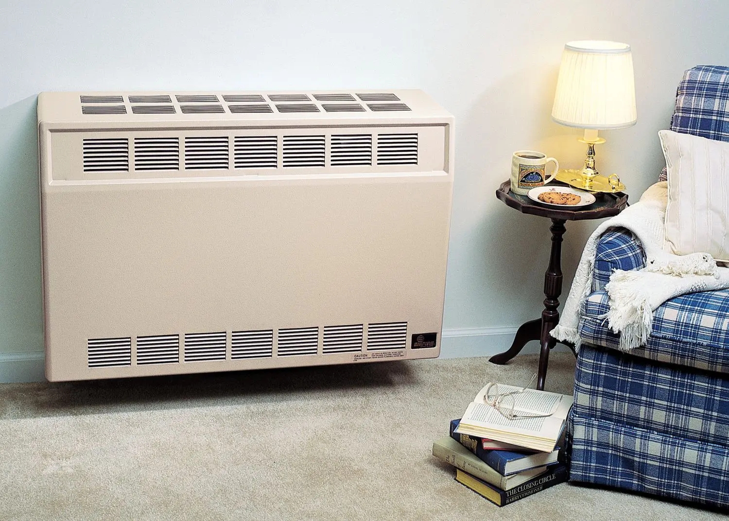 Empire heater installed in wall near chair
