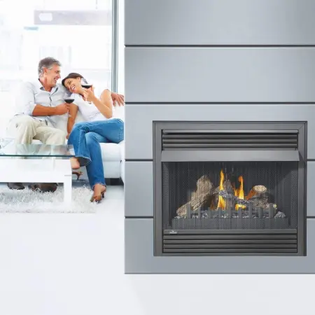 Grandville fireplace with couple on couch