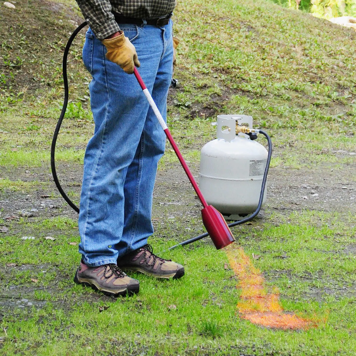 Man using Red Dragon Torch Kit in yard