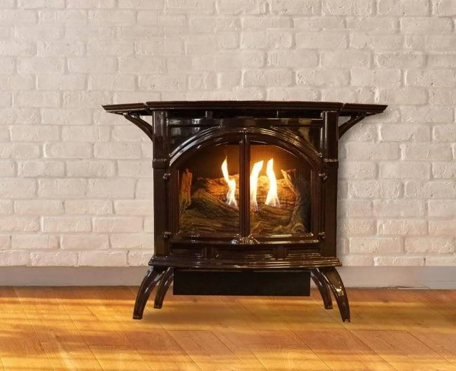 White Mountain Heart Cast Iron Stove close-up against brick will