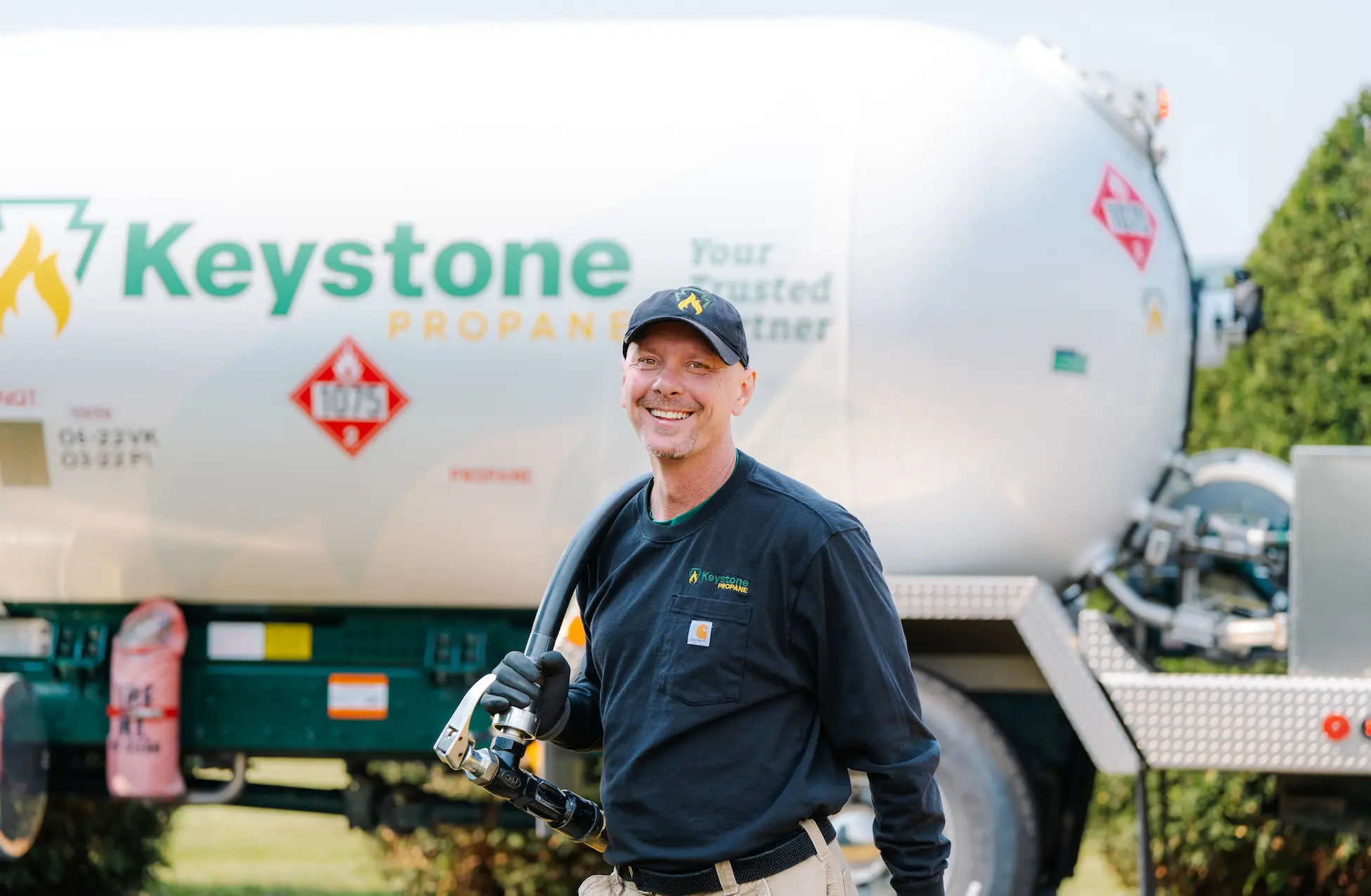 Keystone-005 Employee smiling alongside propane truck