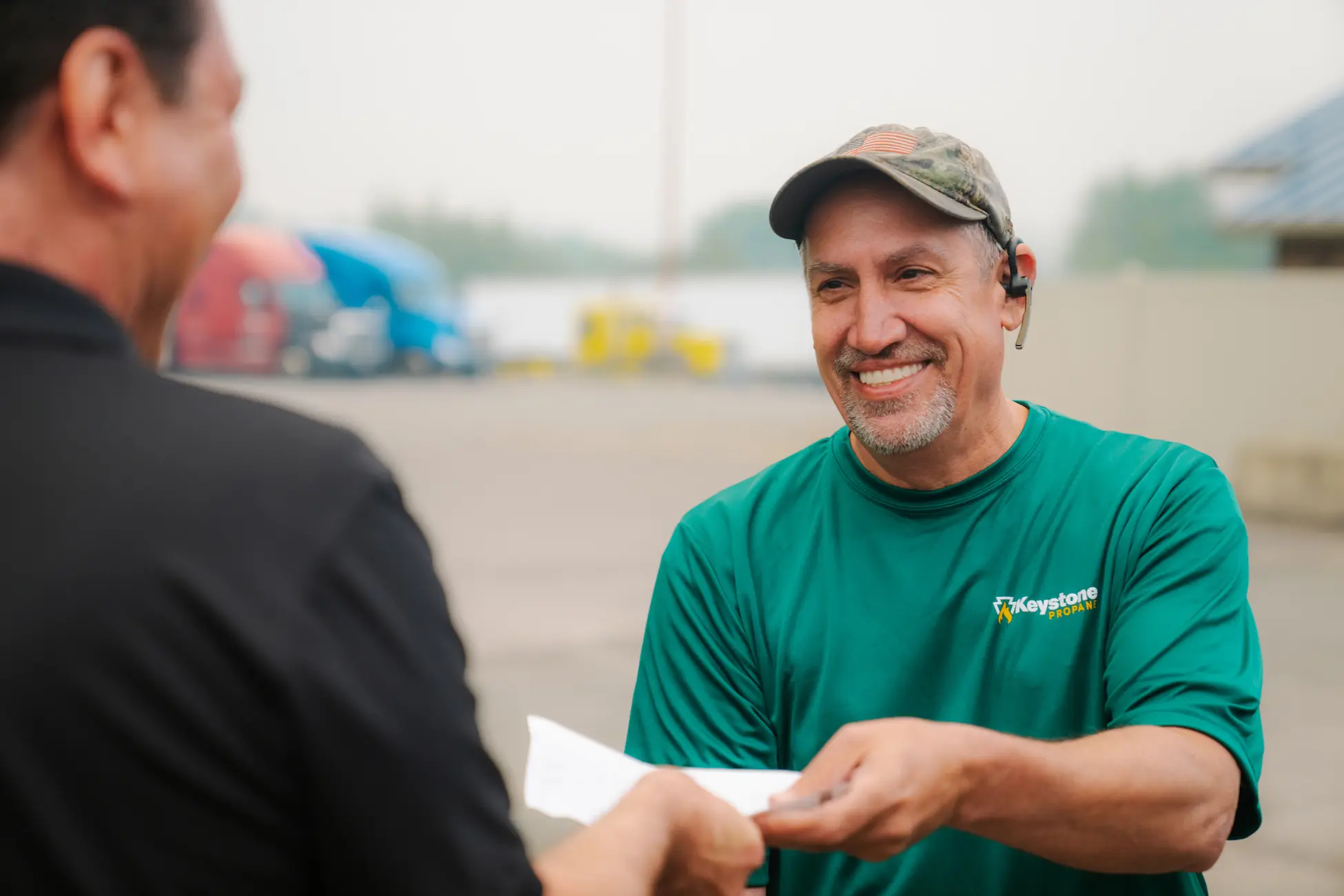 Keystone-213 Close up of Keystone Propane employee handing receipt to customer