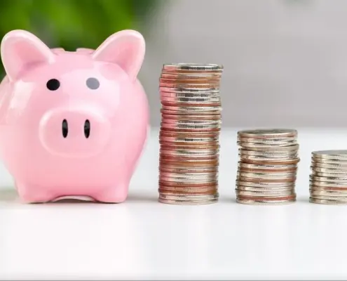 Piggy bank with stacks of coins