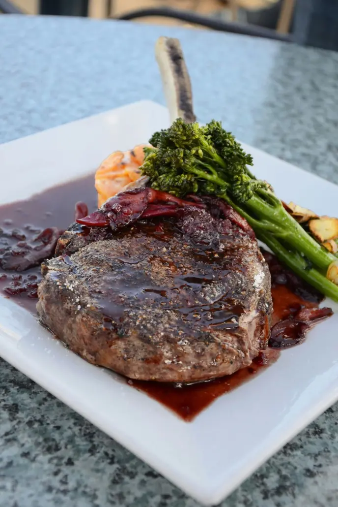 Cooked tomahawk steak with broccoli and potatoes