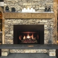 White Mountain Hearth Rushmore Insert installed in stone fireplace