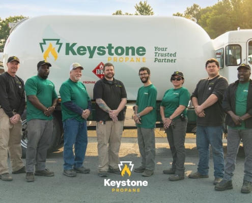 Group shot of employees in front of delivery truck