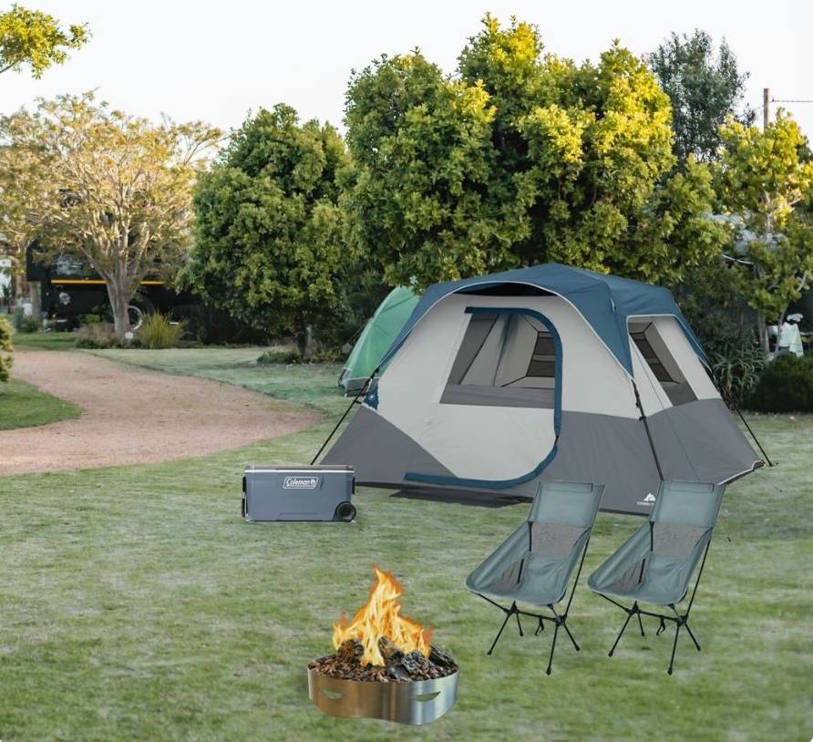 Campsite with tent, cooler, chairs, and firepit.