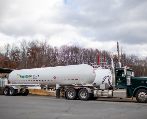 Tanker truck parked at dock in Throop