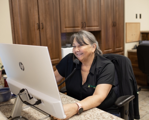 Employee talking on phone at desk