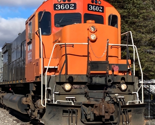 Orange train pulling in