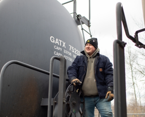 Employee on back of railcar