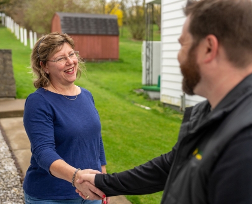 Employee shaking hands with customer