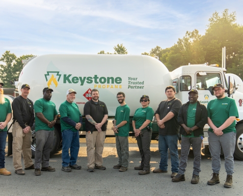 Group shot of employees in front of bobtail