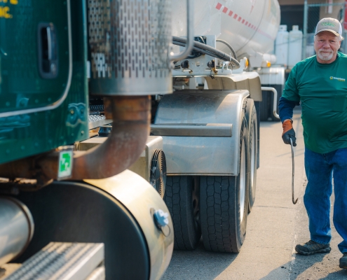 Employee standing next to transport