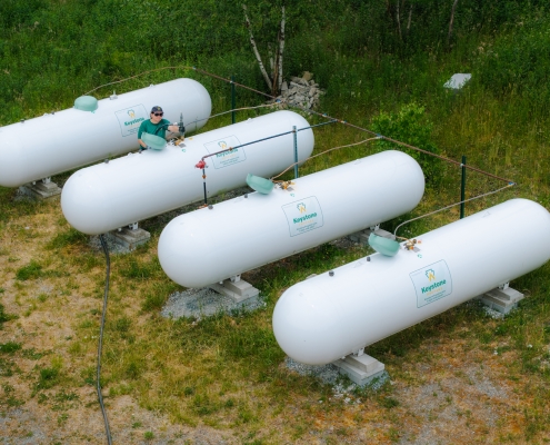 4 tanks with employee aerial view