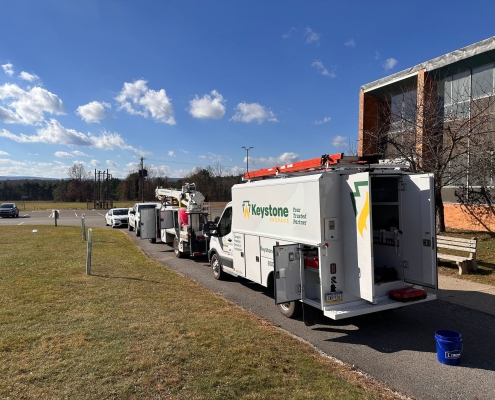 Reverse shot of Keystone vehicles at job site