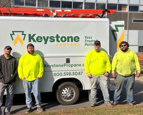 Techs standing in front of Keystone van