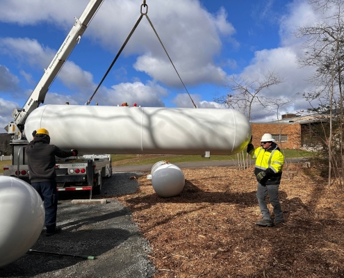 Propane tank suspended with crane